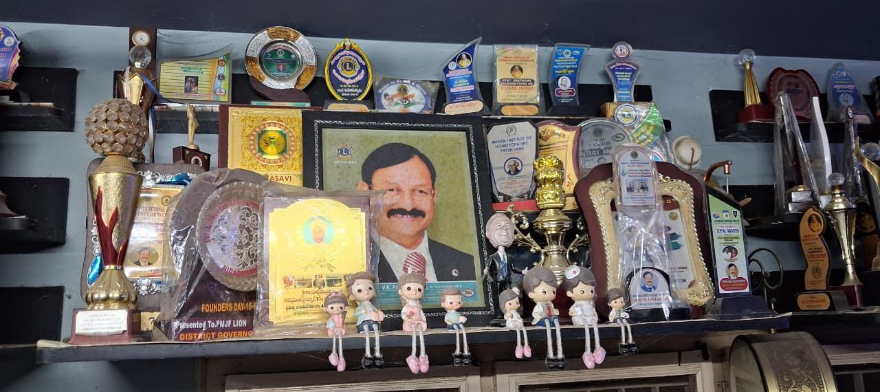 Award recognising Dr. V.K. Pankajakshan's contribution to homoeopathy